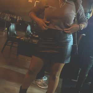 Black faux leather mini skirt. Tags still on. Never worn